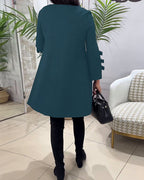 MEREDITH | RONDE HALS CUT-OUT MOUW SWING DRESS